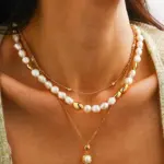 Bohemian Freshwater Pearl Choker Necklace 3 Young woman wearing LIVKE bohemian pearl choker necklace with floral dress in sunflower field, showcasing cottagecore aesthetic jewelry