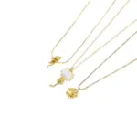 Woman wearing LIVKE cat and shell necklace walking with cat on sunset beach, symbolizing pet love and coastal aesthetic jewelry