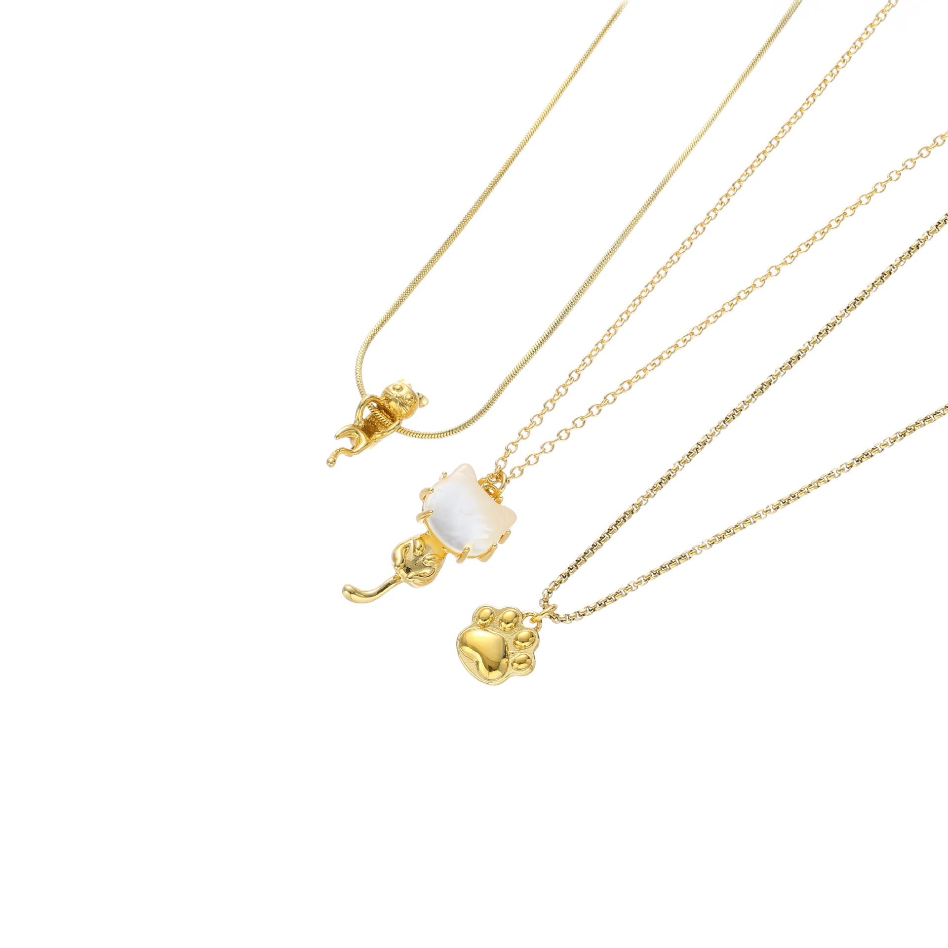 Woman wearing LIVKE cat and shell necklace walking with cat on sunset beach, symbolizing pet love and coastal aesthetic jewelry