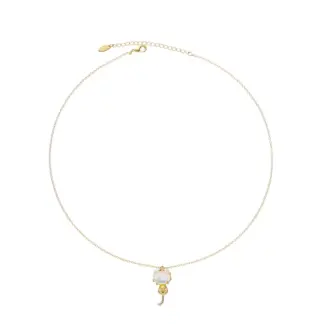 Woman wearing LIVKE cat and shell necklace walking with cat on sunset beach, symbolizing pet love and coastal aesthetic jewelry