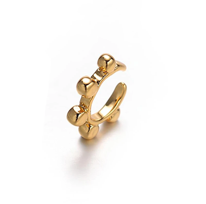 livke-eternal-pulse-heart-ring-stackable (2) 18K gold-plated adjustable heart ring with brilliant zirconia center, layered with minimalist bands on marble texture