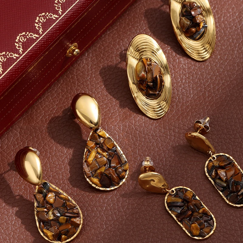 livke-gold-teardrop-earrings-tiger-eye-boho.jpg (5) Woman wearing LIVKE teardrop tiger eye earrings with tailored blazer, showcasing minimalist office jewelry with natural stone accents