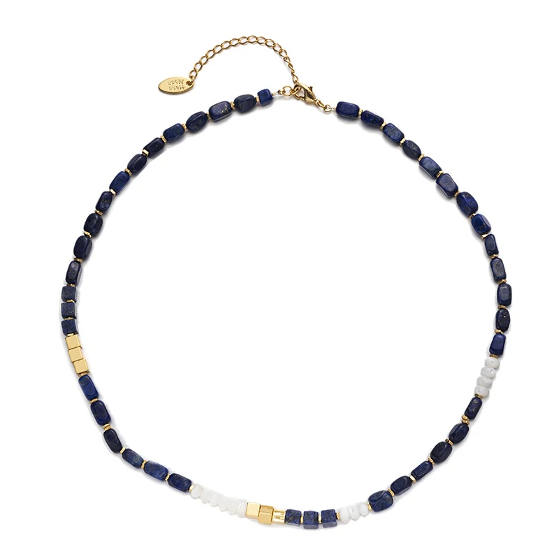 Woman wearing LIVKE lapis lazuli and gold beaded necklace with tailored black dress, showcasing mysterious yet elegant office-to-event jewelry