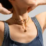 Multi-Color Natural Stone Necklace 2 Woman wearing LIVKE multi-color stone necklace at desert festival, showcasing boho jewelry with adjustable gold pendant