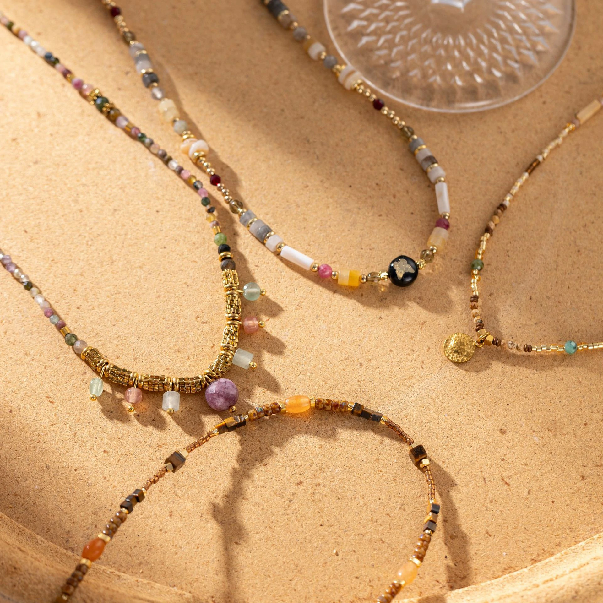 livke-multi-color-stone-necklace-boho-layering (3) Woman wearing LIVKE multi-color stone necklace at desert festival, showcasing boho jewelry with adjustable gold pendant