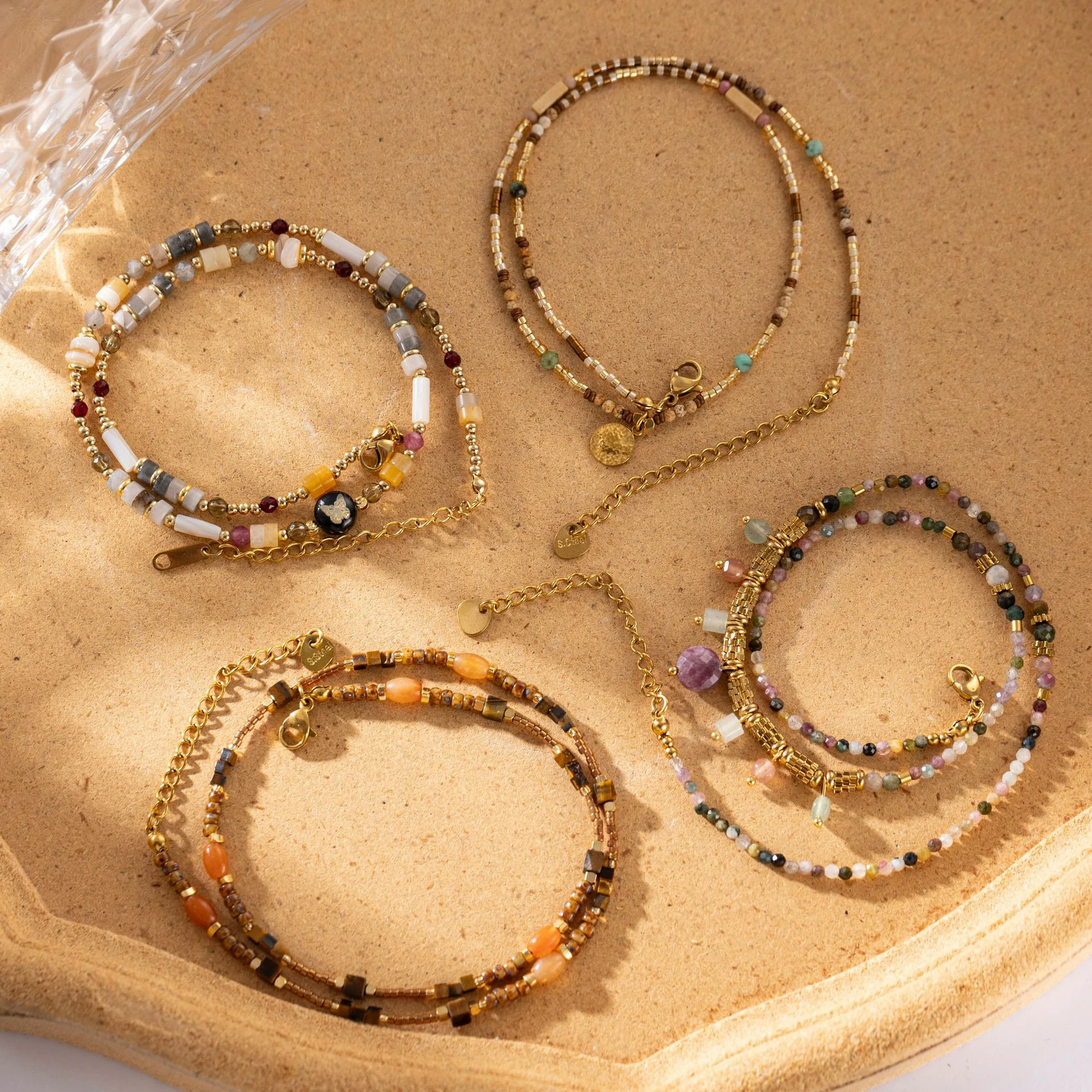 livke-multi-color-stone-necklace-boho-layering (4) Woman wearing LIVKE multi-color stone necklace at desert festival, showcasing boho jewelry with adjustable gold pendant