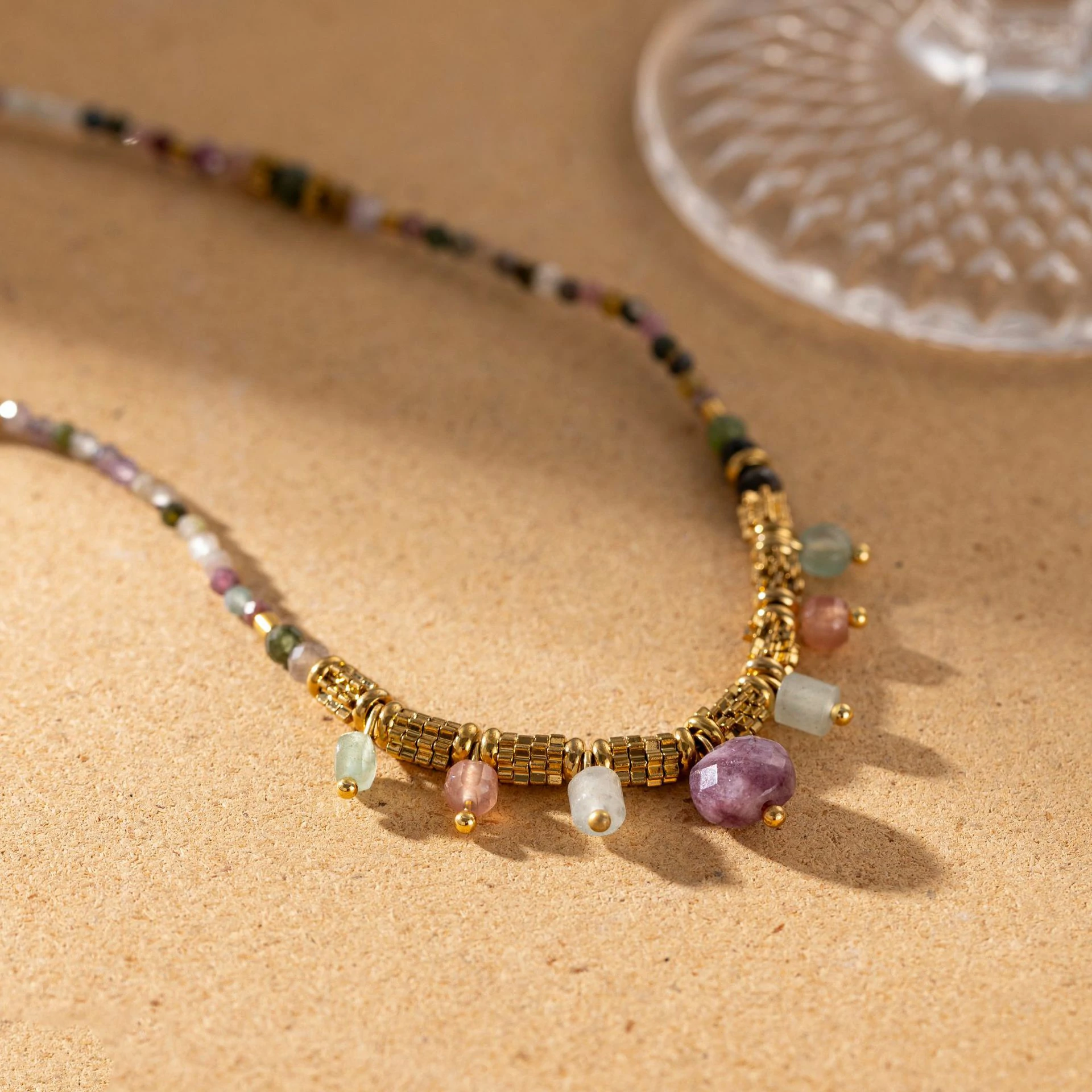 livke-multi-color-stone-necklace-boho-layering (6) Woman wearing LIVKE multi-color stone necklace at desert festival, showcasing boho jewelry with adjustable gold pendant