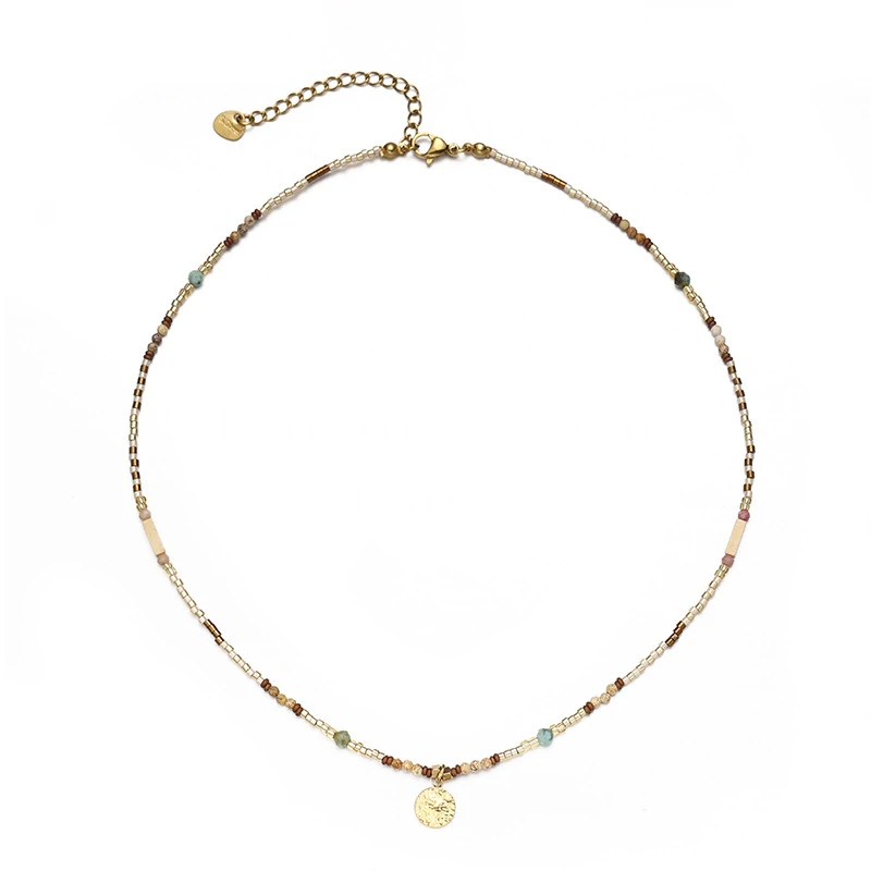 livke-multi-color-stone-necklace-boho-layering Woman wearing LIVKE multi-color stone necklace at desert festival, showcasing boho jewelry with adjustable gold pendant