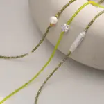 Natural Freshwater Pearl & Green Beaded Necklace 5 Woman wearing LIVKE pearl and green beaded necklace with silk blouse, showcasing minimalist jewelry for work and evening events