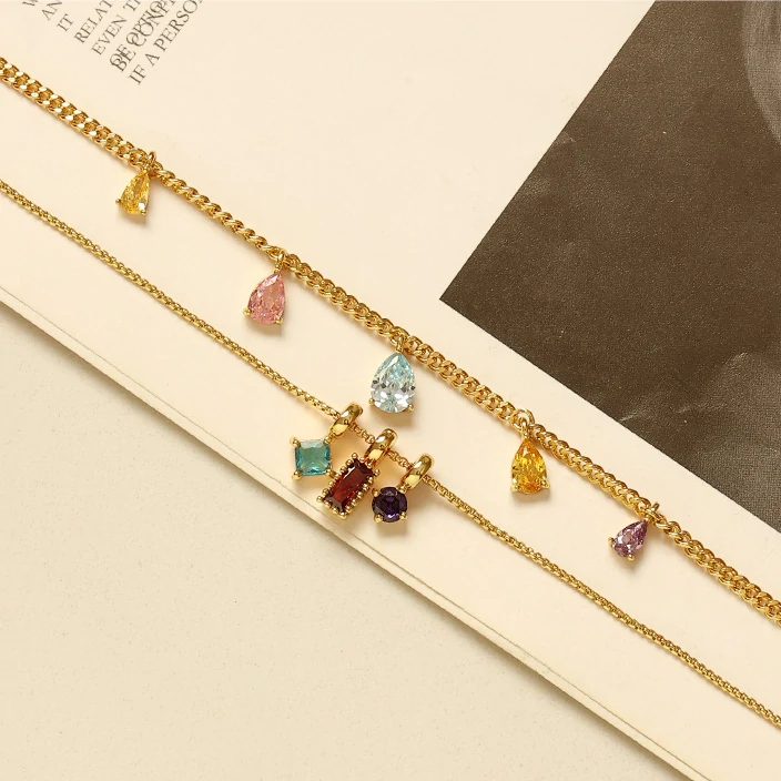 livke-rainbow-zirconia-pendant-necklace-day-to-night (3) Woman wearing LIVKE multicolor zirconia necklace transitioning from office blazer to cocktail dress, showcasing prismatic jewelry for versatile styling