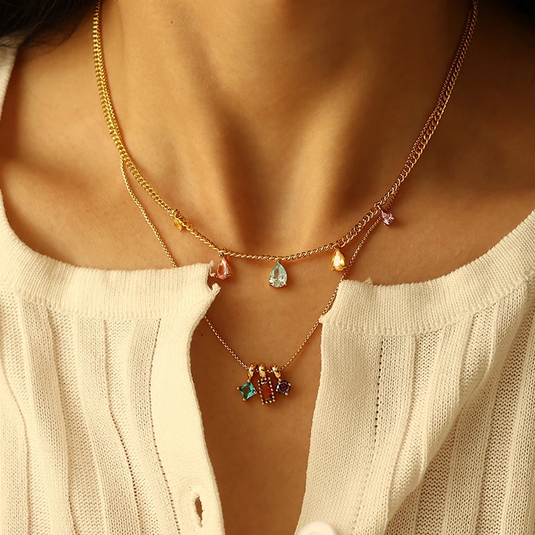 livke-rainbow-zirconia-pendant-necklace-day-to-night (4) Woman wearing LIVKE multicolor zirconia necklace transitioning from office blazer to cocktail dress, showcasing prismatic jewelry for versatile styling