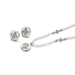 Natural Shell Bead Floral Pendant Necklace 1 Woman wearing LIVKE shell bead necklace with floral pendant at beach sunset, showcasing boho chic jewelry for summer adventures