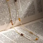 Tri-Bead Adjustable Necklace 5 LIVKE gold-plated adjustable tri-bead necklace styled as double layers with minimalist pendants, showing day-to-night versatility