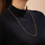Tri-Bead Adjustable Necklace 3 LIVKE gold-plated adjustable tri-bead necklace styled as double layers with minimalist pendants, showing day-to-night versatility