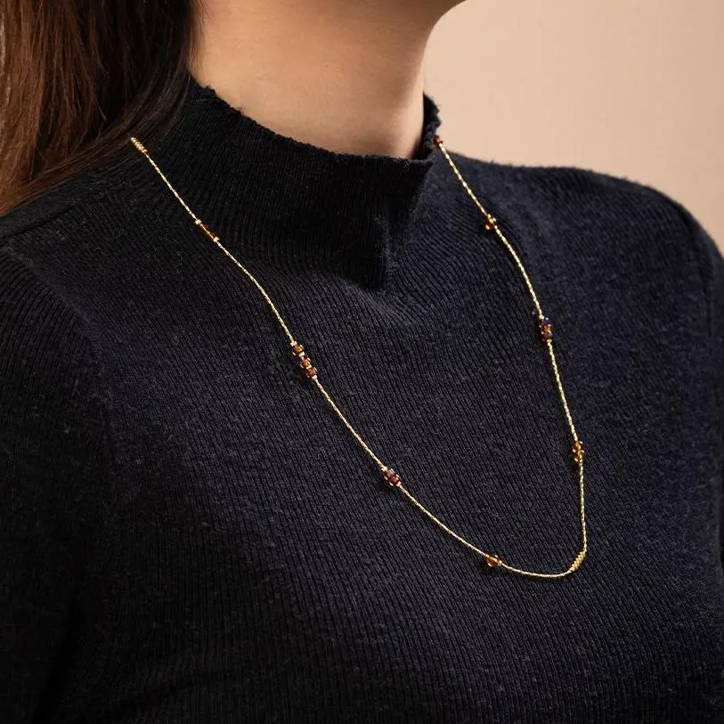 LIVKE gold-plated adjustable tri-bead necklace styled as double layers with minimalist pendants, showing day-to-night versatility