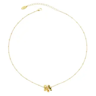 Model wearing LIVKE emerald CZ triple hoop necklace with black turtleneck