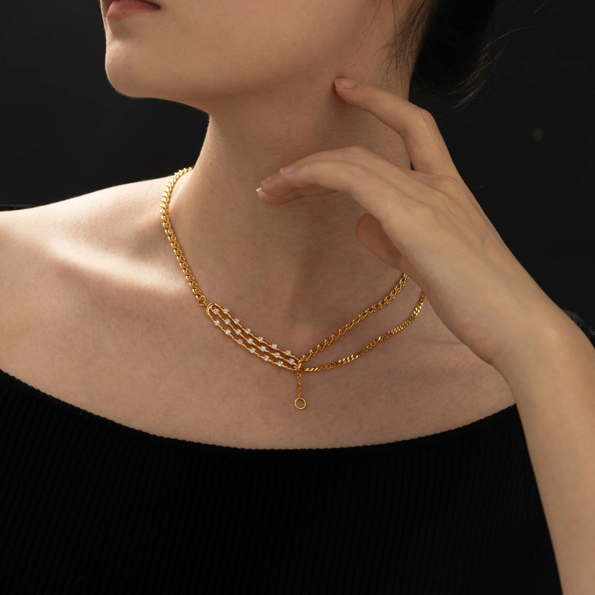 LIVKE gold-plated adjustable chain necklace with cubic zirconia stones, layered with minimal pendants for everyday jewelry styling