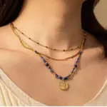 Vintage Lapis Lazuli Pendant Necklace 2 LIVKE’s gold-plated brass necklace featuring a lapis lazuli pendant, styled with a white linen blouse for effortless elegance.