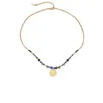Vintage Lapis Lazuli Pendant Necklace 1 LIVKE’s gold-plated brass necklace featuring a lapis lazuli pendant, styled with a white linen blouse for effortless elegance.