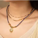 Vintage Lapis Lazuli Pendant Necklace 4 LIVKE’s gold-plated brass necklace featuring a lapis lazuli pendant, styled with a white linen blouse for effortless elegance.