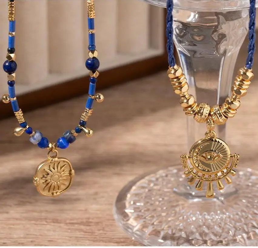 LIVKE’s gold-plated brass necklace featuring a lapis lazuli pendant, styled with a white linen blouse for effortless elegance.