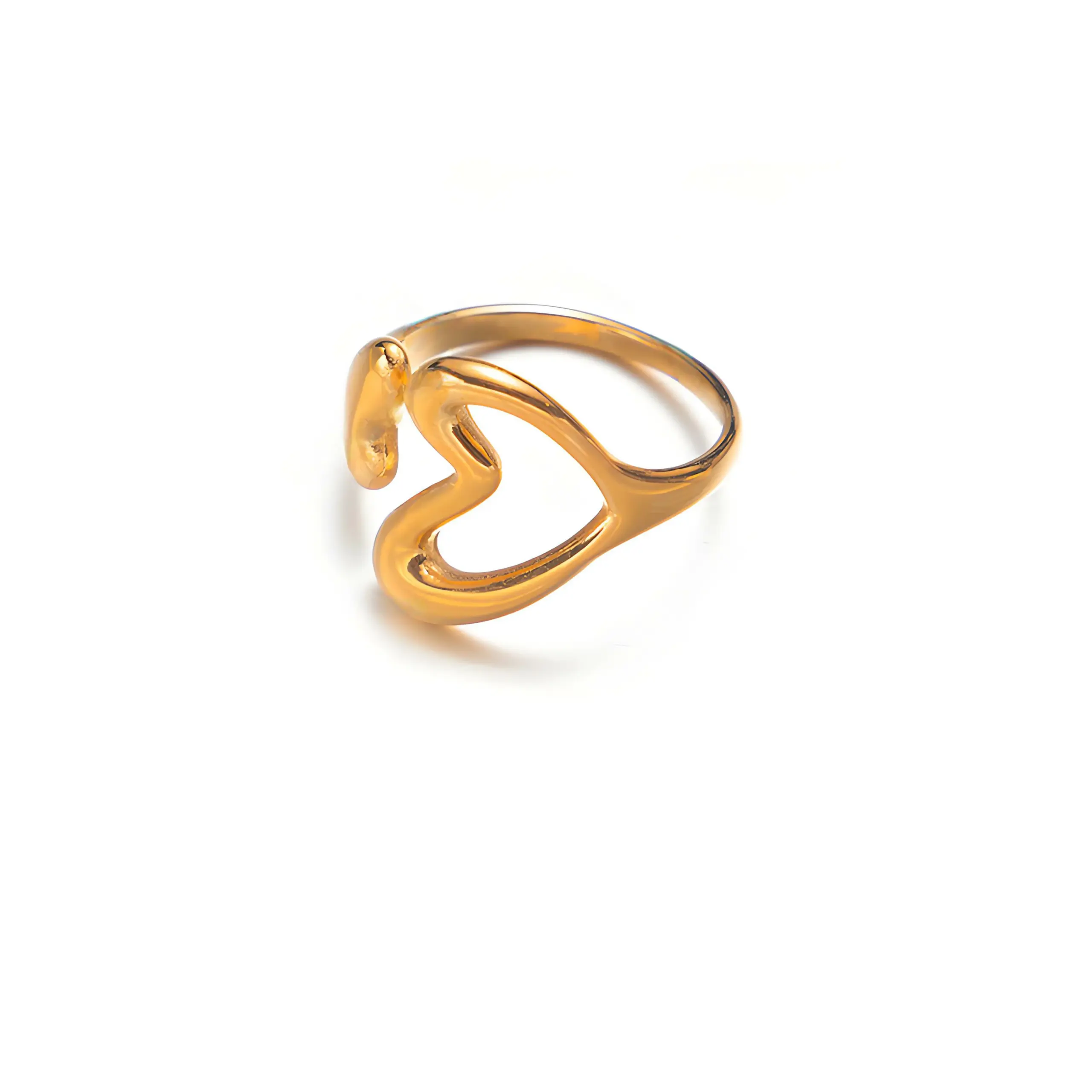 Woman wearing LIVKE gold love signet ring while holding cappuccino in Parisian café, showcasing stackable jewelry styling