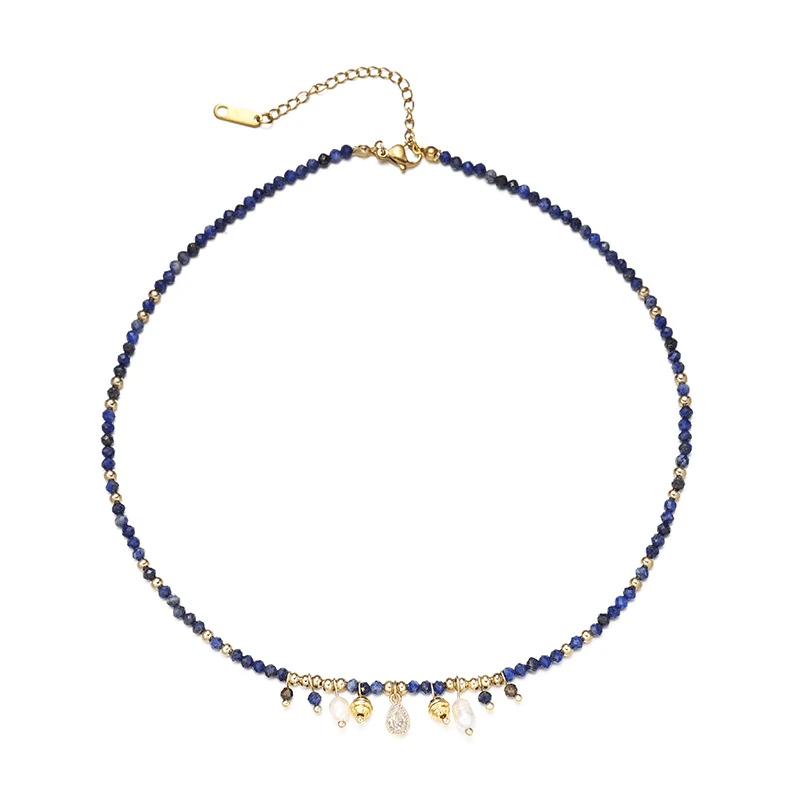 LIVKE 18K gold-plated layered necklace with colored pearls and zirconia, styled with linen and seashells for coastal minimalist aesthetic