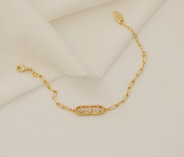 Gold chunky chain bracelet with crystal-encrusted floral pendant, perfect for statement jewelry lovers and art deco inspired accessories