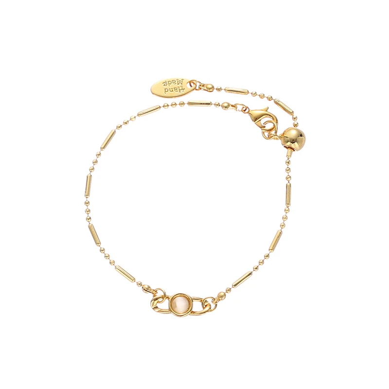 Delicate gold and silver chain set with iridescent shell pendants, perfect for beach weddings and minimalist jewelry lovers