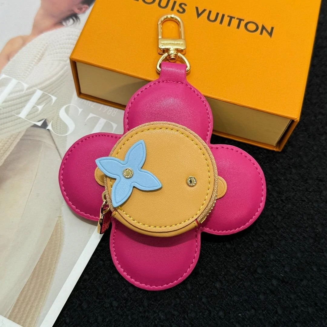 Two Louis Vuitton bag charms
